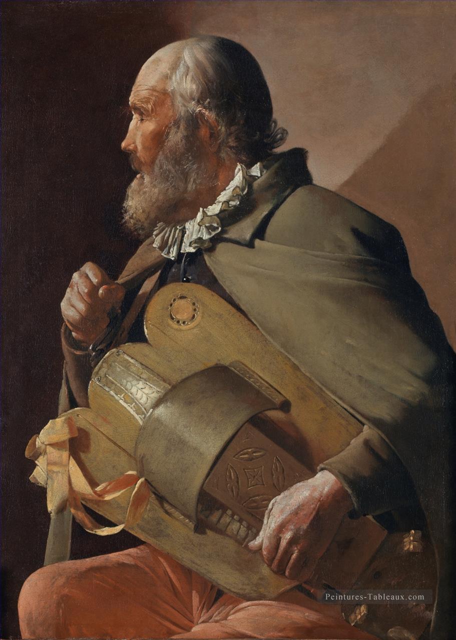 Hurdy Gurdy joueur avec un ruban ABC chandelles Georges de La Tour Peintures à l'huile